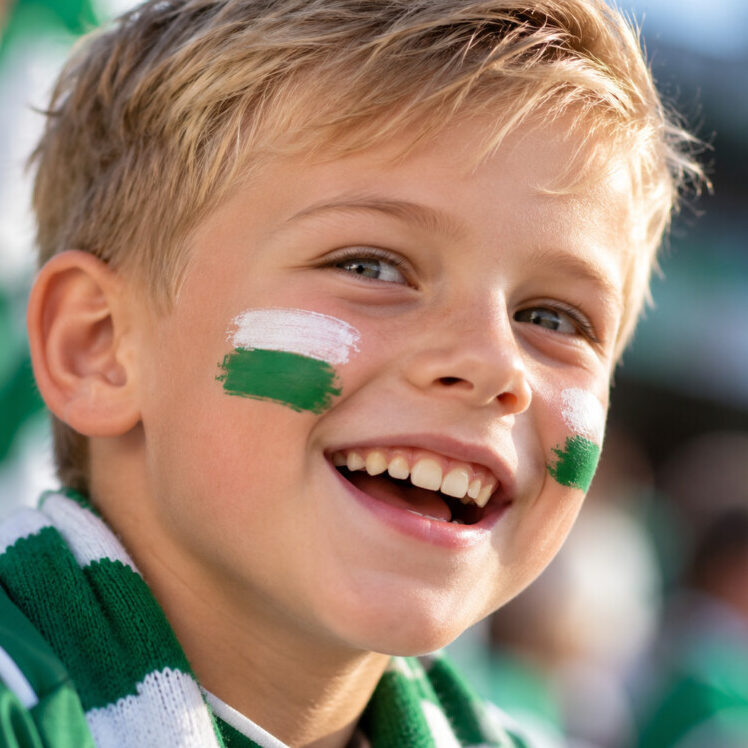 Joyful Young Fan in Green and White